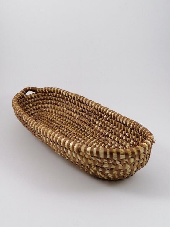 Slender straw handbag with a handle