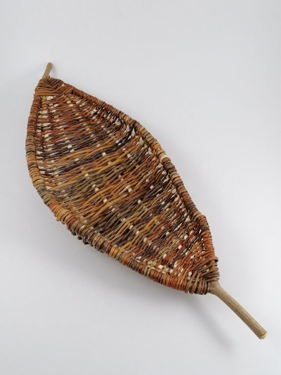 Handwoven basket on a frame made of willow branches – multicolored